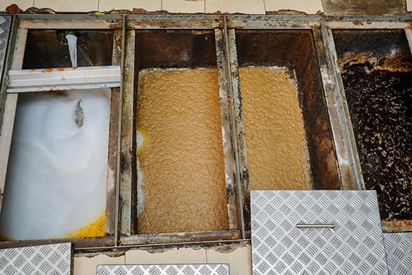 regular grease trap maintenance prevents plumbing issues, improves sanitation, and prolongs the life of the grease trap