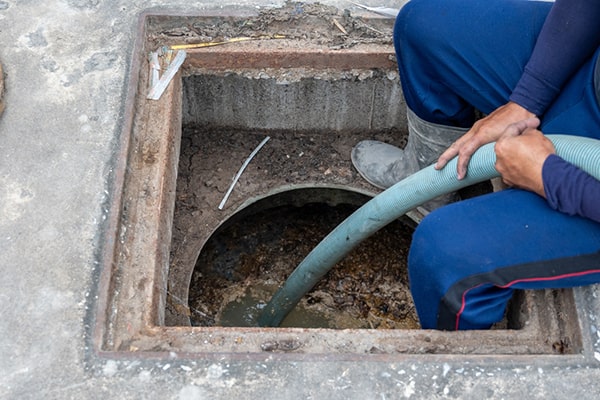 signs that your grease trap needs pumping include slow drainage, foul odors, and visible grease buildup